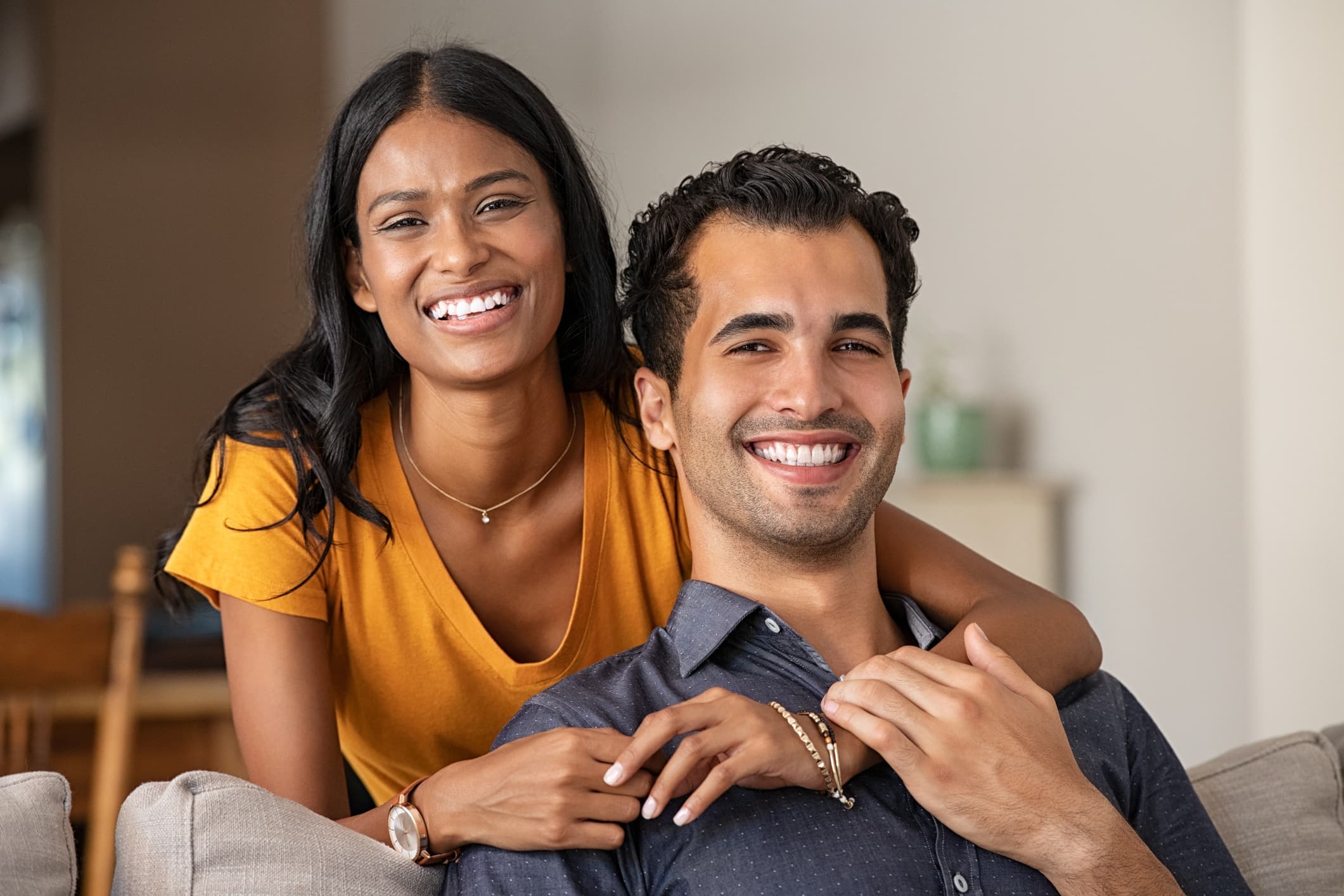 A smiling couple, happy patients ready to visit